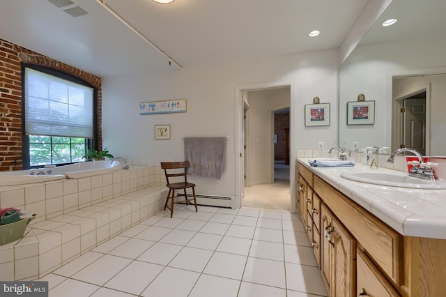 bathroom featuring baseboard heating, dual bowl vanity, tiled bath, and tile patterned flooring