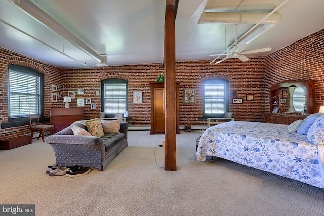 carpeted bedroom with brick wall, ceiling fan, and multiple windows