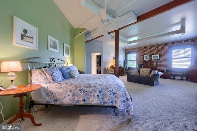 carpeted bedroom with brick wall and ceiling fan