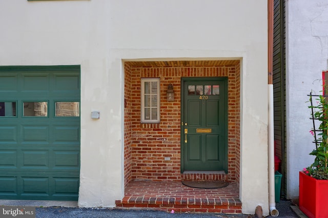 property entrance with a garage