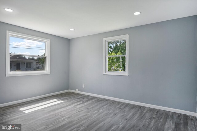 unfurnished room featuring hardwood / wood-style floors