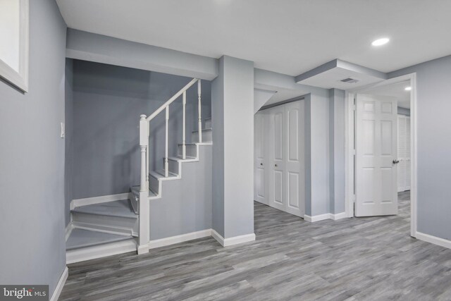 basement with hardwood / wood-style flooring