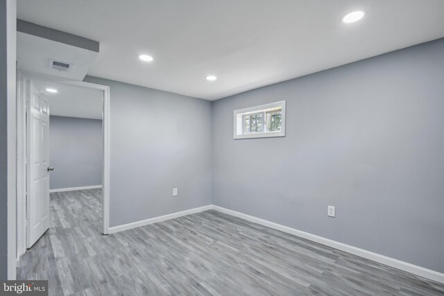 spare room featuring hardwood / wood-style flooring