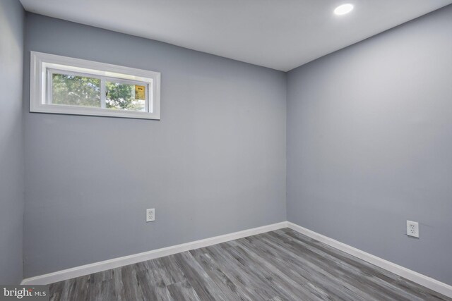 empty room with hardwood / wood-style flooring