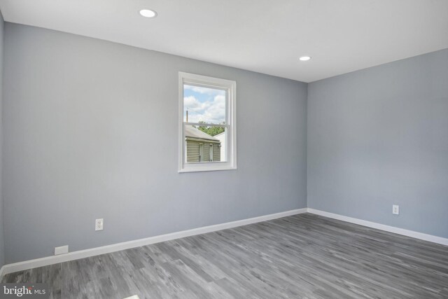 unfurnished room featuring hardwood / wood-style floors