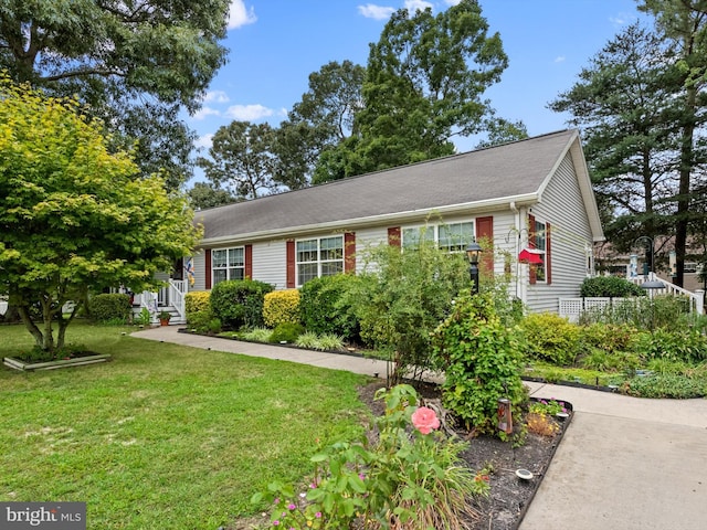 view of front of home with a front lawn