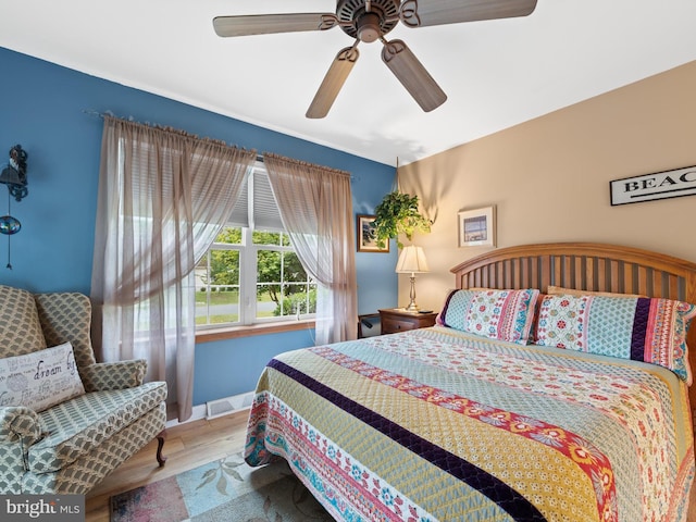 bedroom featuring ceiling fan and hardwood / wood-style floors