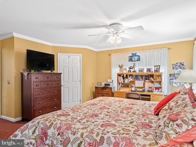 carpeted bedroom featuring ceiling fan and crown molding