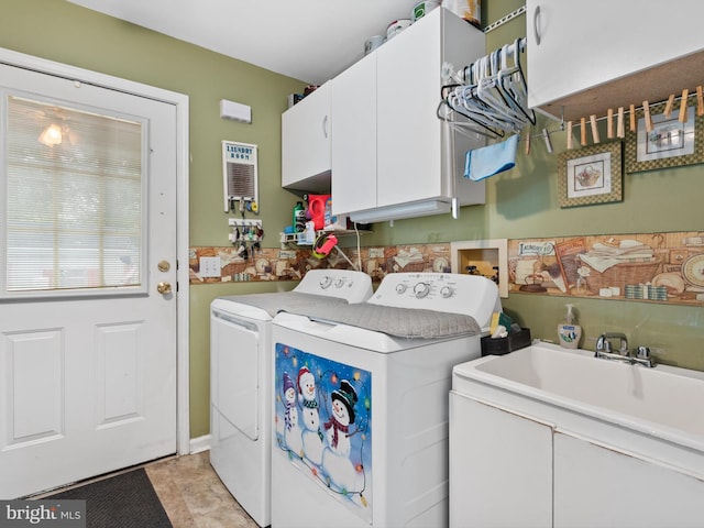 laundry area with cabinets, light tile patterned floors, and washer and dryer