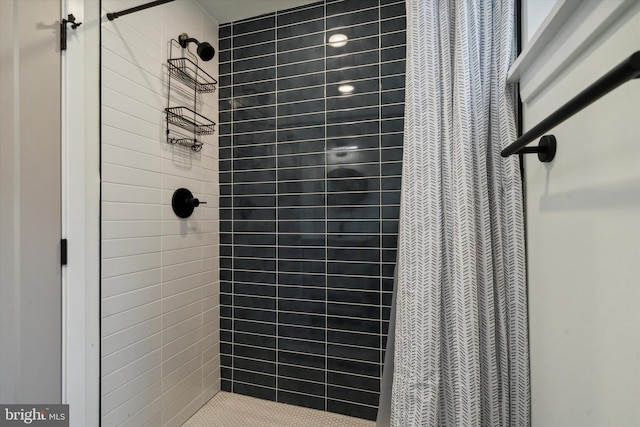 bathroom featuring a shower with curtain