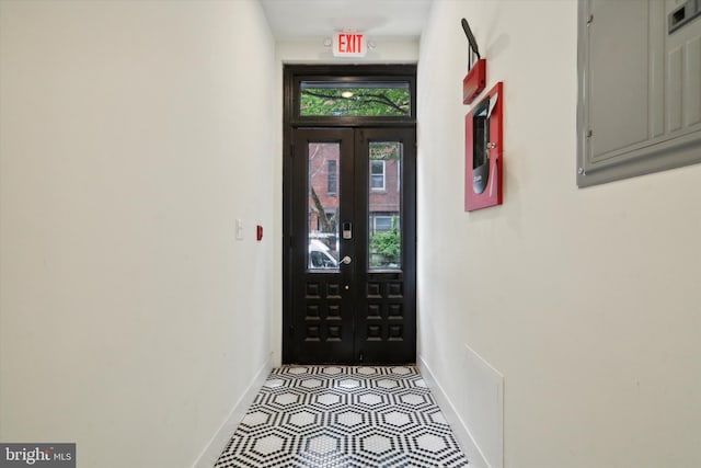 doorway to outside featuring light tile patterned floors