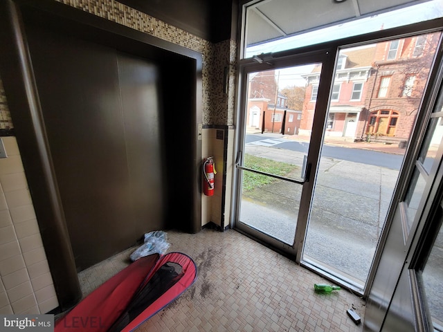 doorway featuring tile patterned flooring