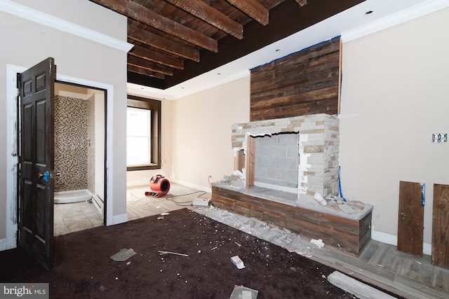 unfurnished living room with beam ceiling, crown molding, wooden ceiling, and a fireplace