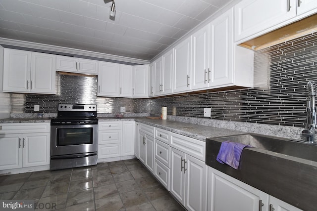 kitchen with stainless steel electric range oven and white cabinetry