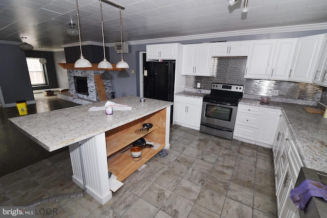 kitchen with decorative light fixtures, electric range, ornamental molding, a kitchen island, and white cabinets