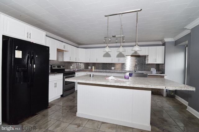 kitchen featuring electric stove, hanging light fixtures, white cabinetry, black refrigerator with ice dispenser, and a kitchen island