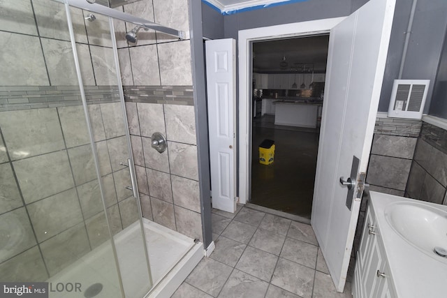 bathroom with vanity and an enclosed shower