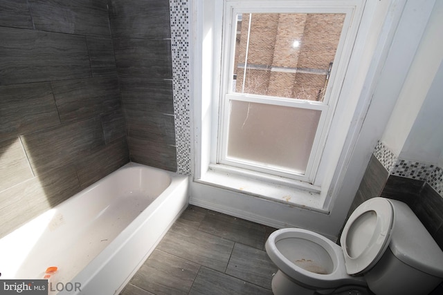 bathroom featuring toilet and tile patterned floors