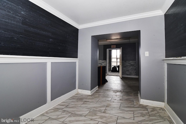 hallway with ornamental molding and light tile patterned floors