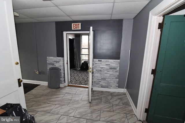 bathroom featuring tile patterned floors and a paneled ceiling