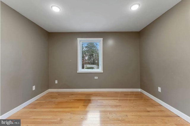 unfurnished room featuring light hardwood / wood-style floors