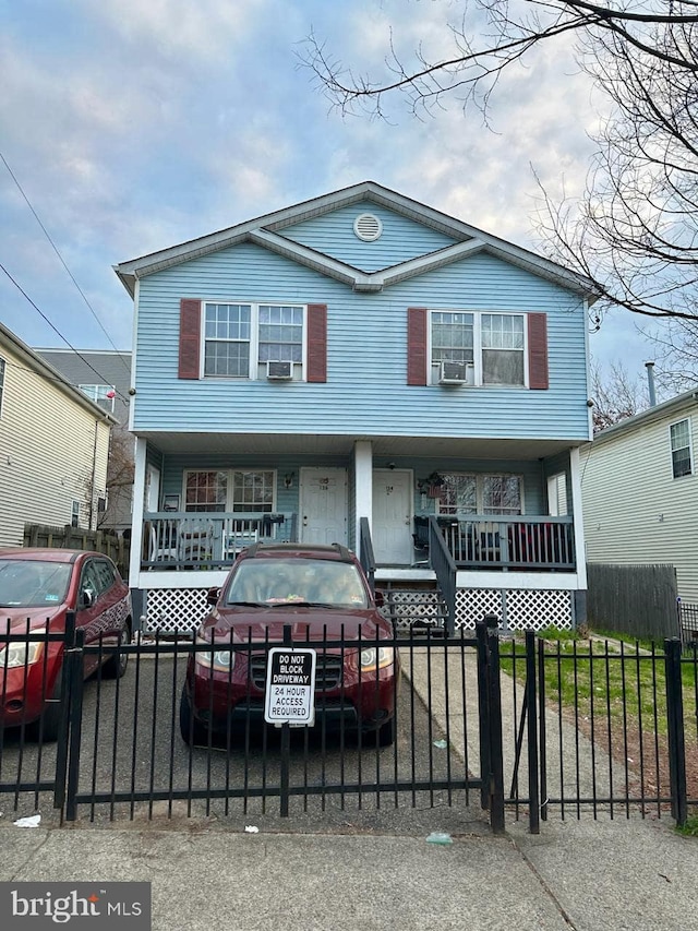 view of front of home featuring cooling unit and covered porch