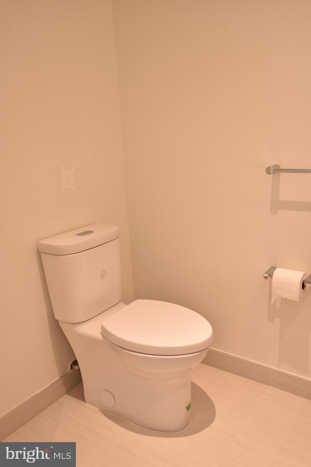 bathroom featuring tile patterned floors and toilet