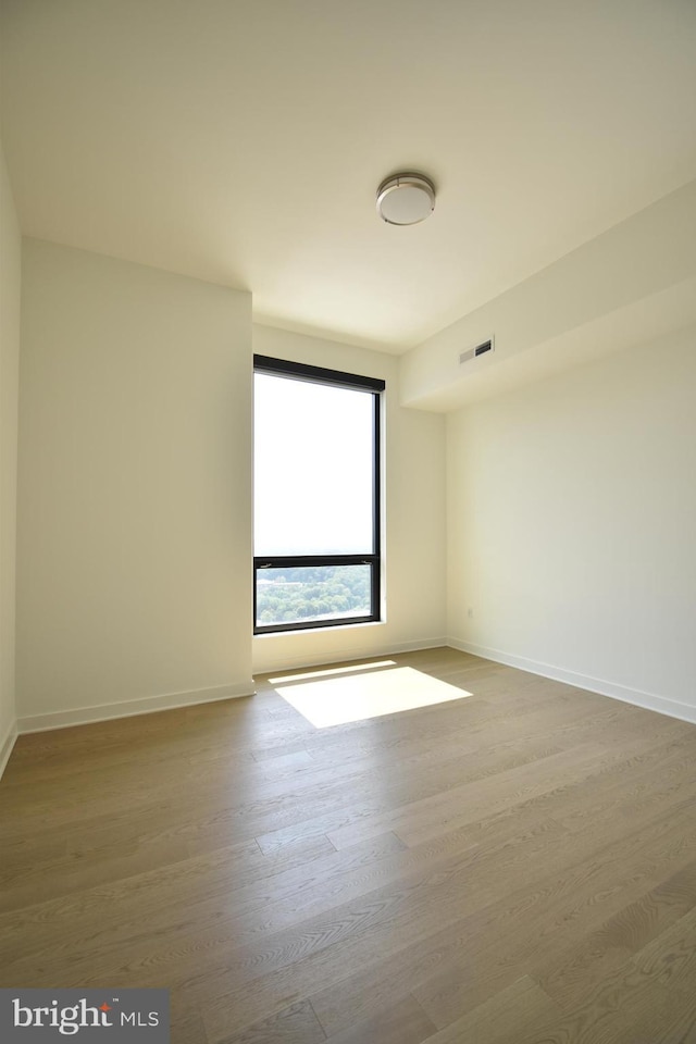 empty room featuring hardwood / wood-style flooring