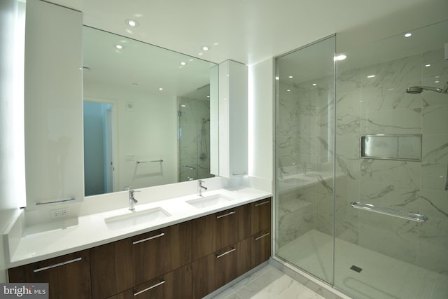 bathroom featuring vanity and an enclosed shower