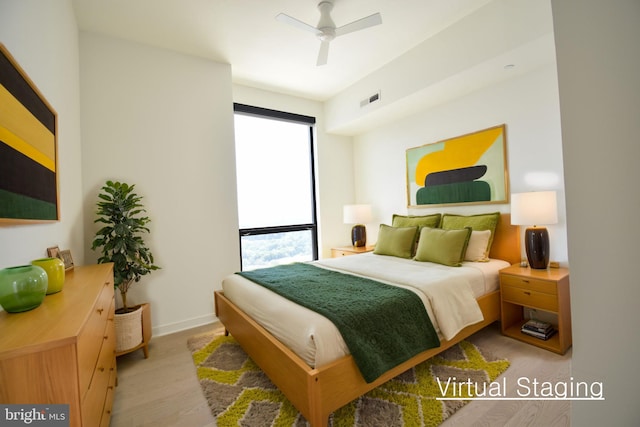 bedroom featuring ceiling fan and light wood-type flooring