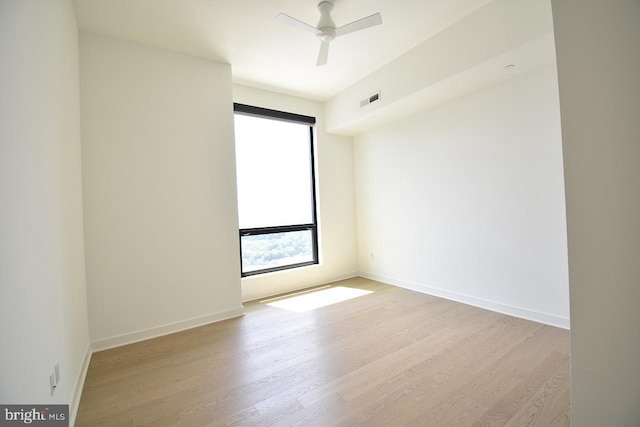 unfurnished room featuring ceiling fan and light wood-type flooring