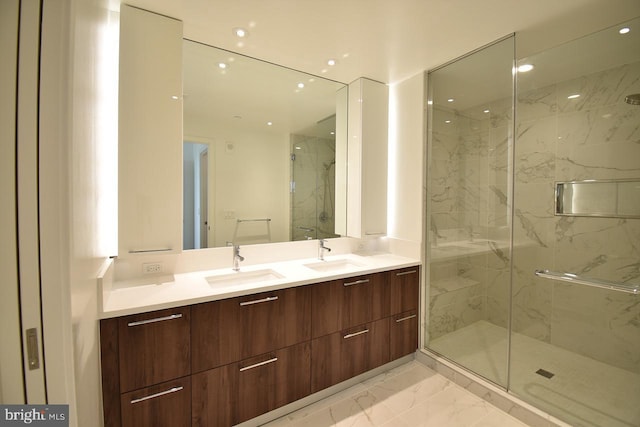 bathroom featuring vanity and a shower with shower door