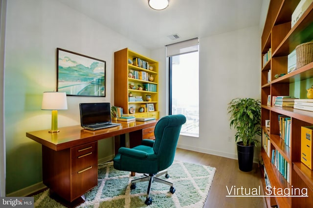 home office with light wood-type flooring