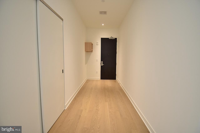 corridor featuring light hardwood / wood-style flooring