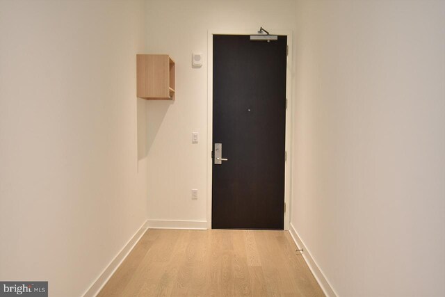 hallway featuring light wood-type flooring