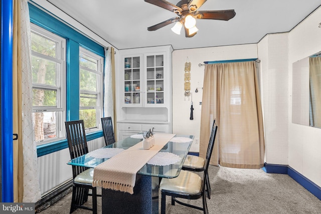 dining room featuring carpet flooring and ceiling fan