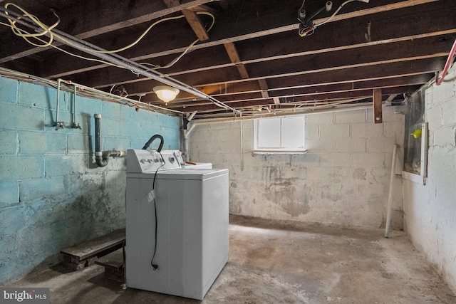 basement with washer and clothes dryer