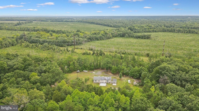 drone / aerial view with a forest view and a rural view