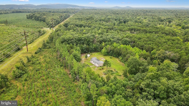 aerial view with a mountain view and a forest view