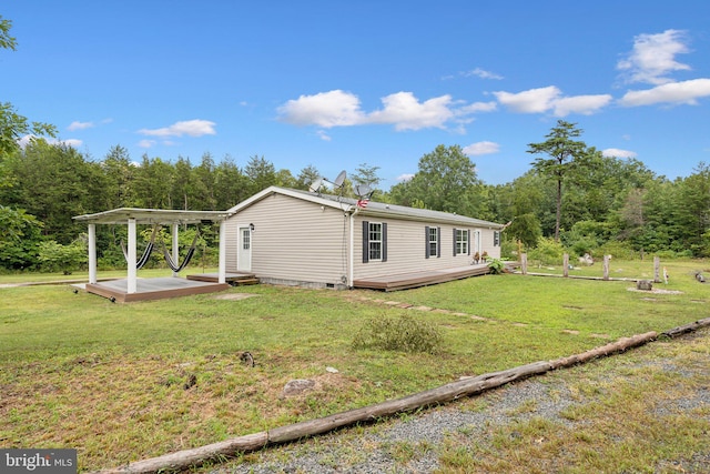 view of property exterior with crawl space, a yard, and a wooden deck