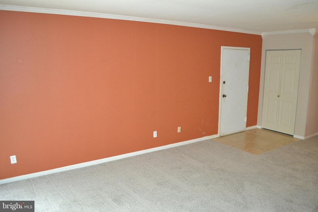 carpeted empty room with crown molding