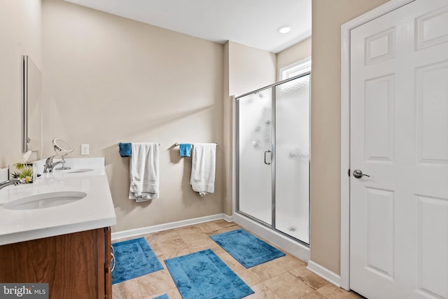 bathroom featuring vanity and walk in shower