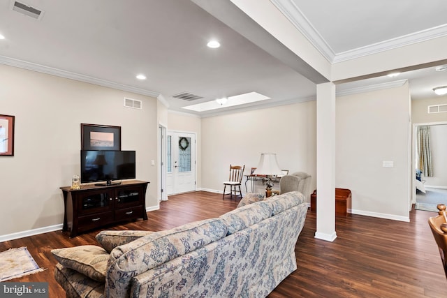 living room featuring ornamental molding, dark hardwood / wood-style floors, and a skylight