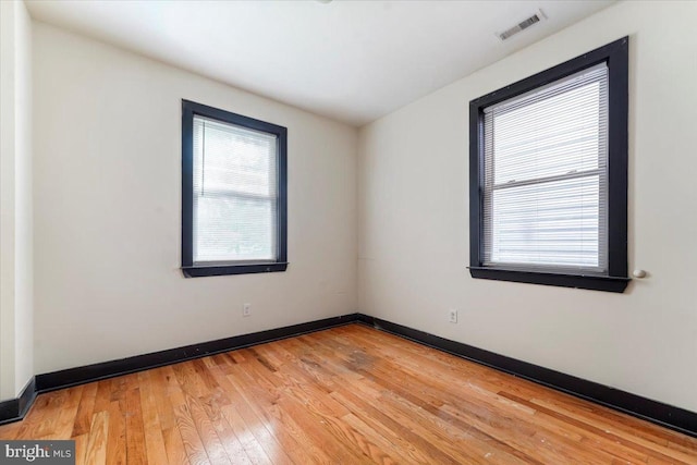 unfurnished room featuring light hardwood / wood-style flooring