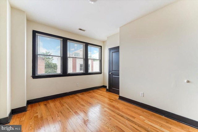 unfurnished room featuring light hardwood / wood-style flooring