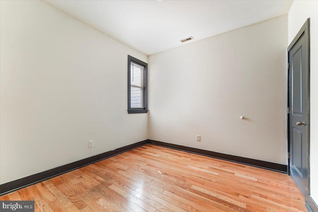 unfurnished room featuring light hardwood / wood-style flooring