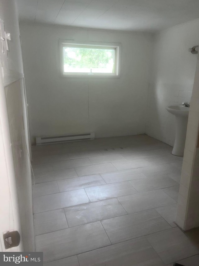 bathroom featuring tile patterned floors and baseboard heating