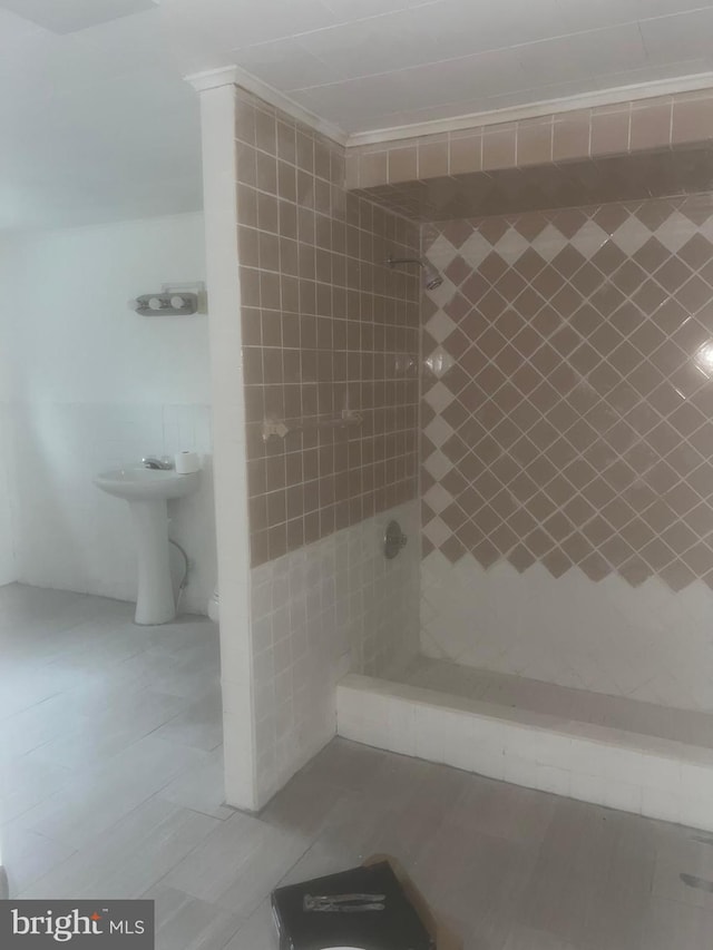 bathroom featuring sink and tile patterned flooring