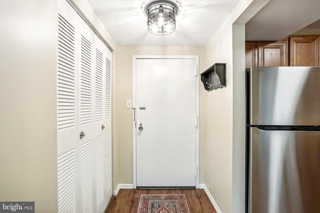 doorway to outside with dark hardwood / wood-style flooring