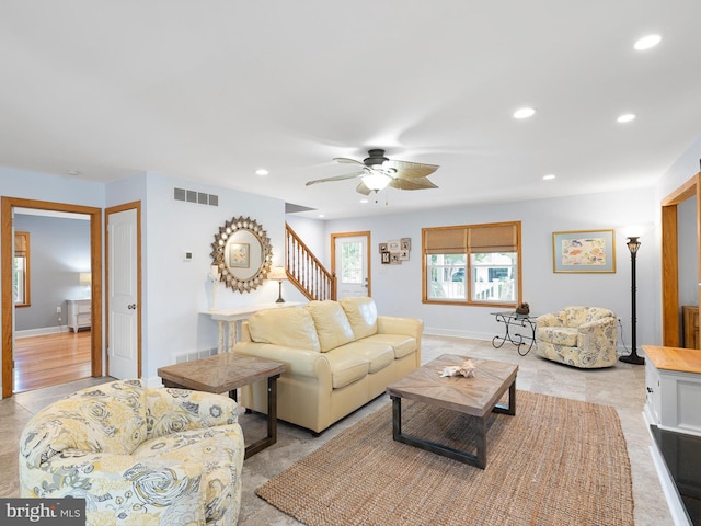 living room with ceiling fan and light wood-type flooring